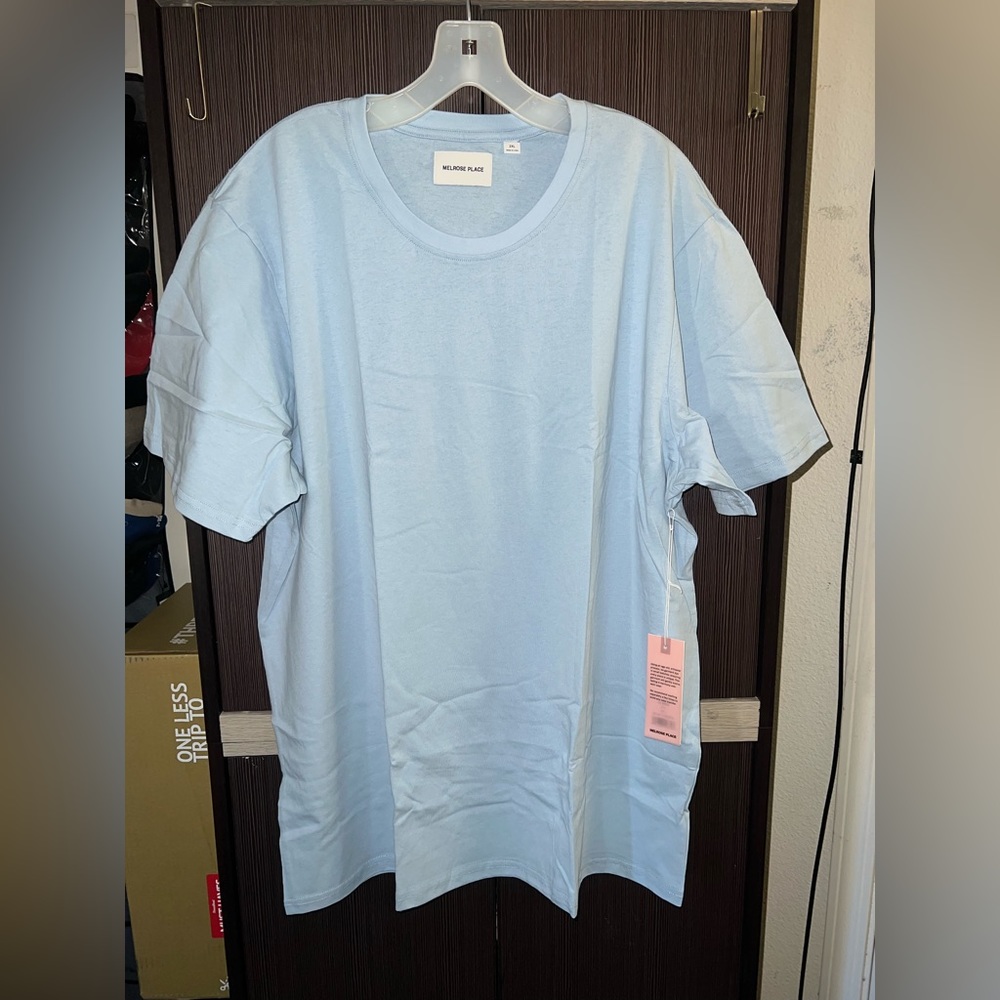 Brand new never worn light blue shirt